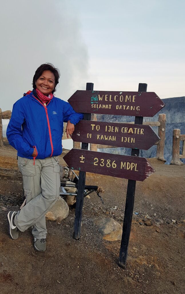 Travel writer Shannim at Ijen Crater in Banyuwangi, East Java, Indonesia.