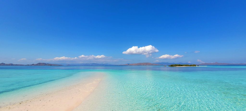 Taka Makassar sandbank surrounded by clear water in Komodo island