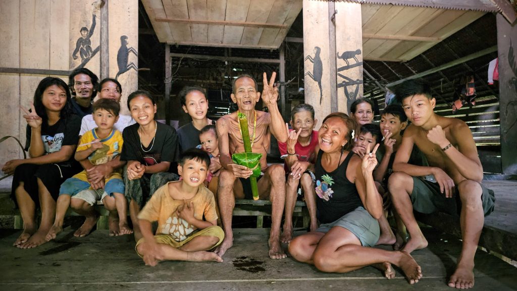 Shannim with the Mentawai Tribe Indonesia inside the traditional uma in Siberut