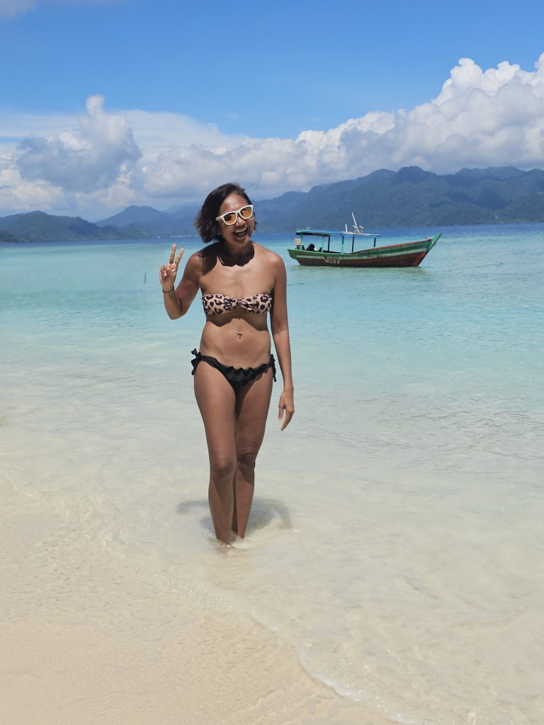 Shannim on the beach on an island near Ricky's Beach House in Sungai Pinang
