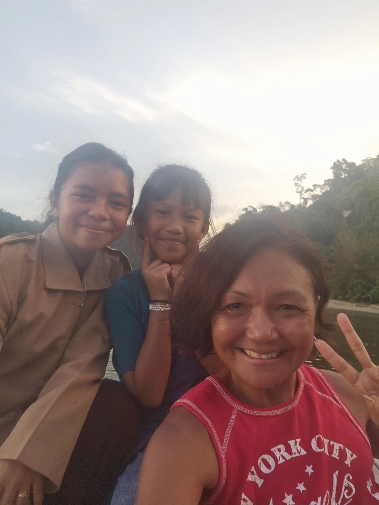 Shannim with local children at Ricky's Beach House, Sungai Pinang, West Sumatra