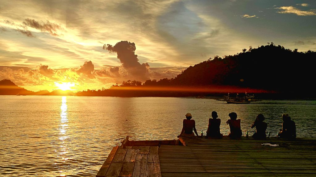 Sunset at the jetty at Ricky Beach House in Sungai Pinang, West Sumatra