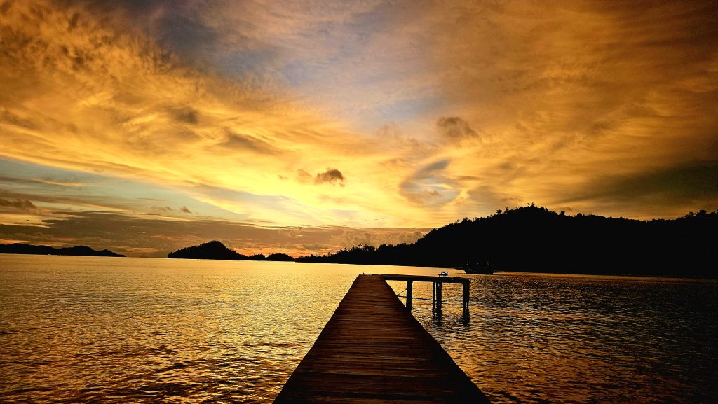 Sunset over the jetty at Ricky Beach House in Sungai Pinang