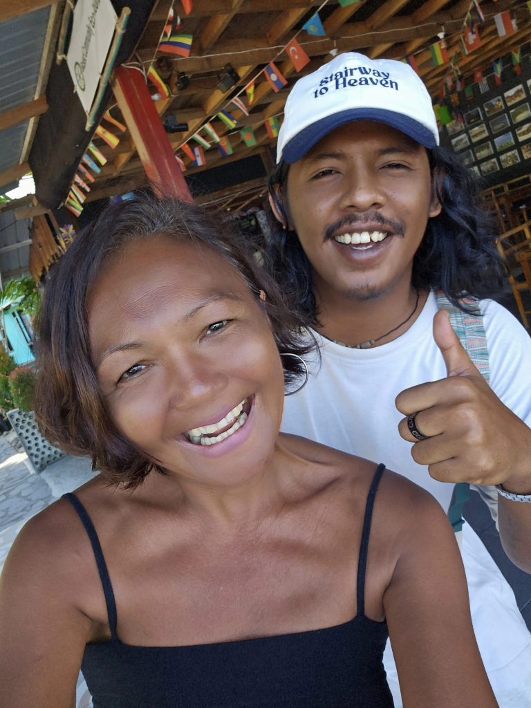 Travel writer Shannim with staff member at Ricky's Beach House, Sungai Pinang - experiencing community-based tourism in West Sumatra