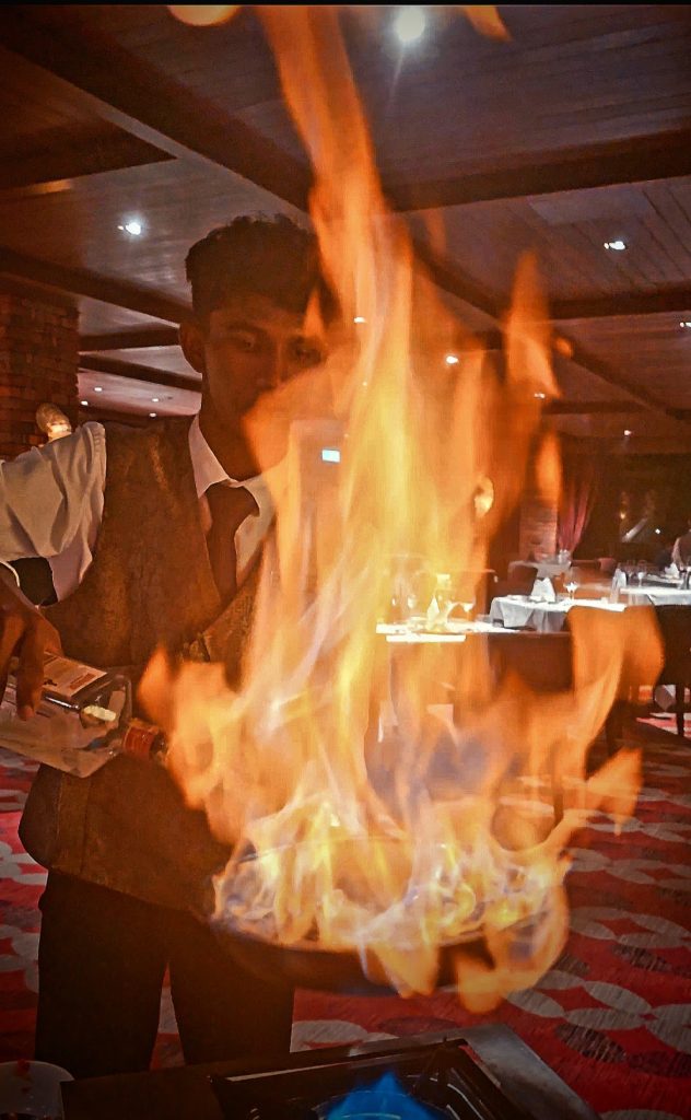 Tableside flambé preparation at Feringgi Grill restaurant, Shangri-La Rasa Sayang, Penang