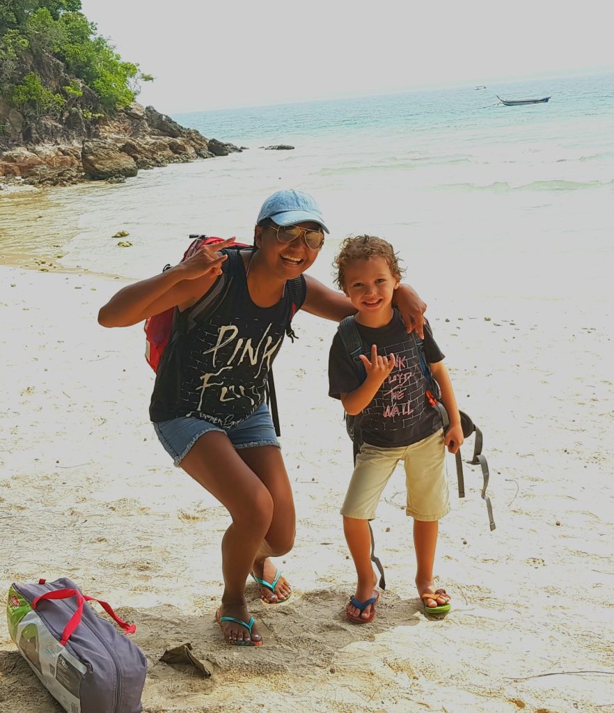 The writer and her son travelling light on an island