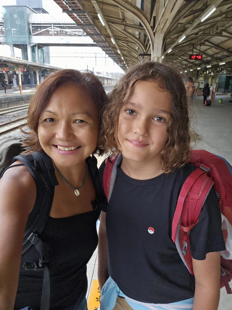 Mother and son travelling light with backpacks while exploring Taiwan