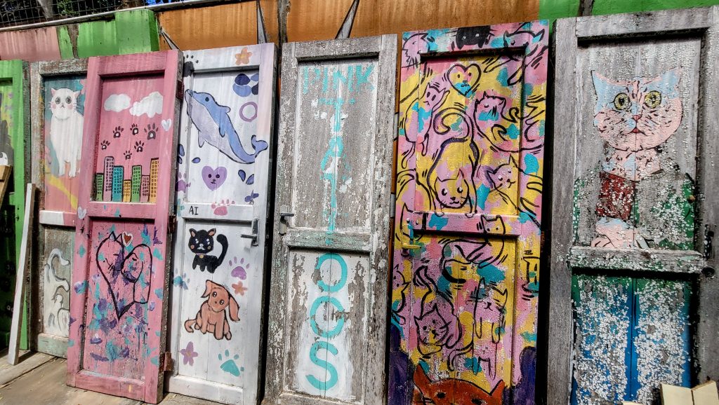 Hand-painted art on antique wooden doors at Bon Ton Resort Langkawi