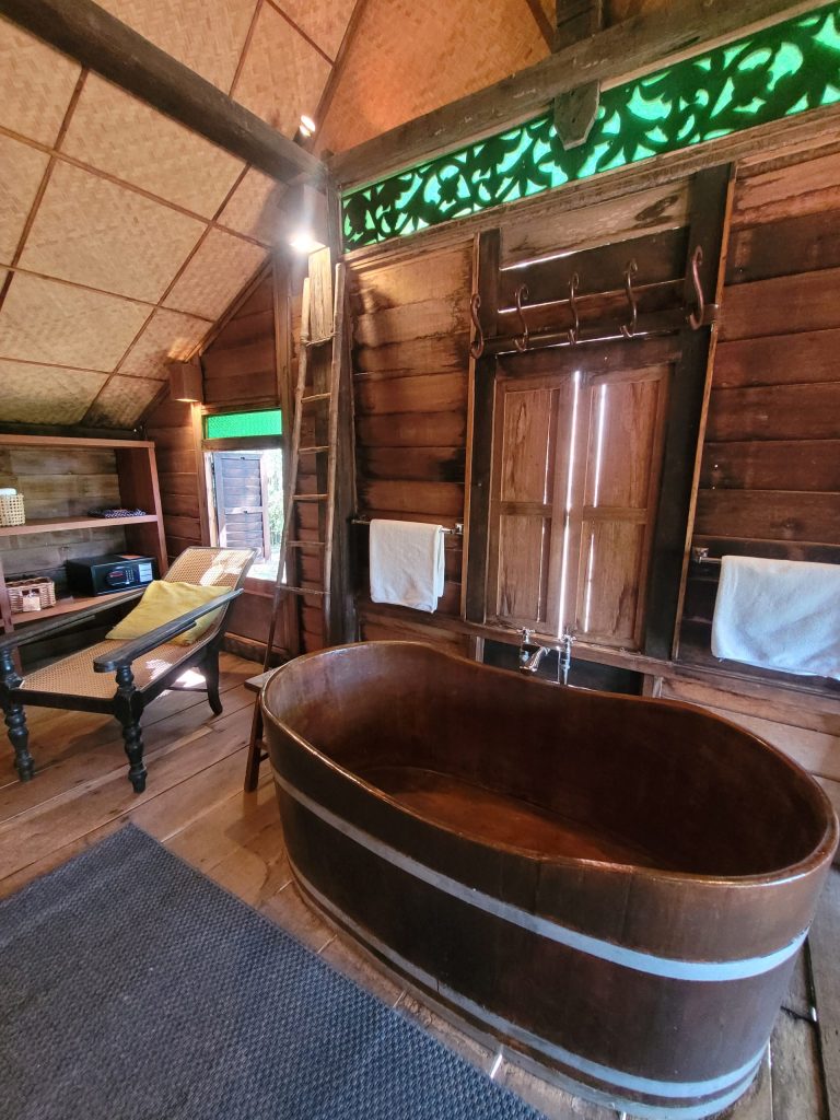 Traditional wooden freestanding bath in Laguna villa at Bon Ton Langkawi