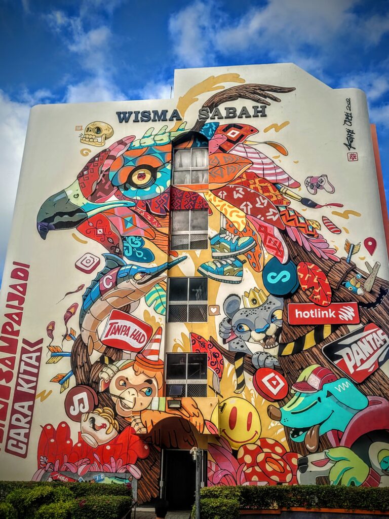 Colourful street art mural on shophouse wall Kota Kinabalu Sabah