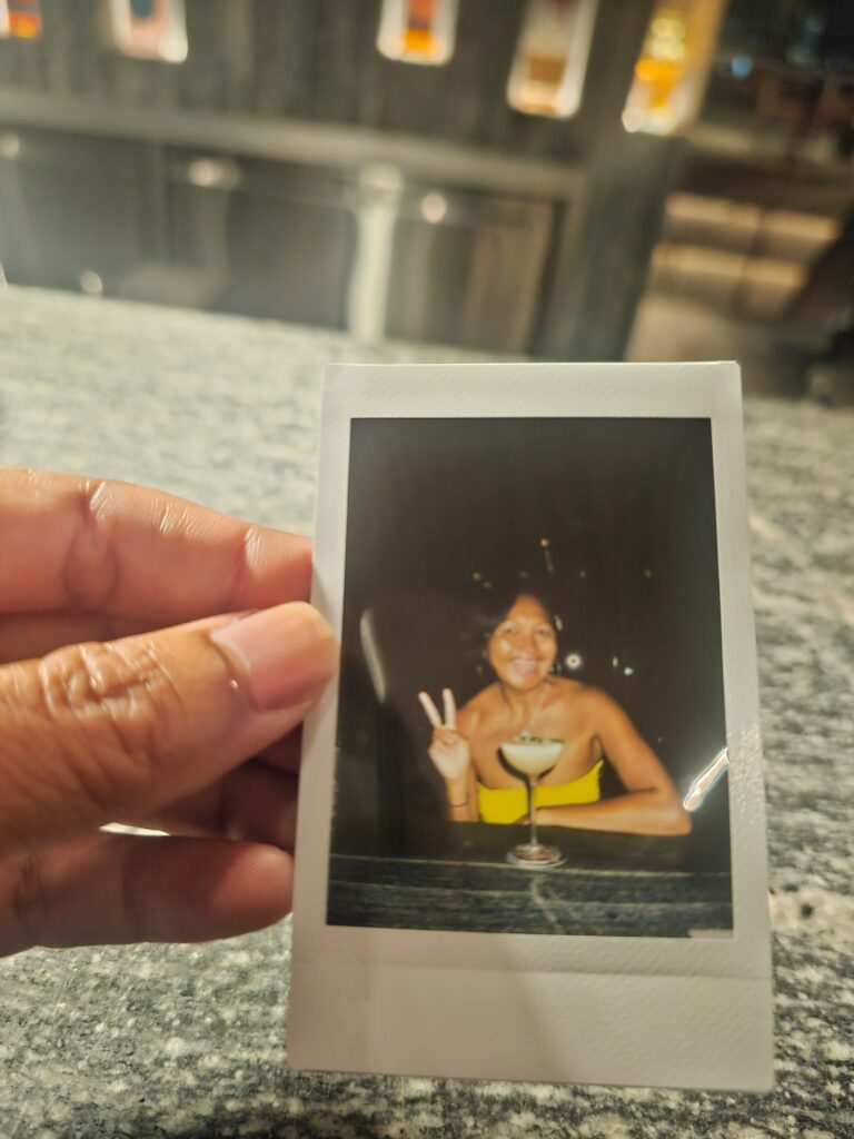 Polaroid photo of The Writer's Cocktail at ON23 rooftop bar Hyatt Centric Kota Kinabalu