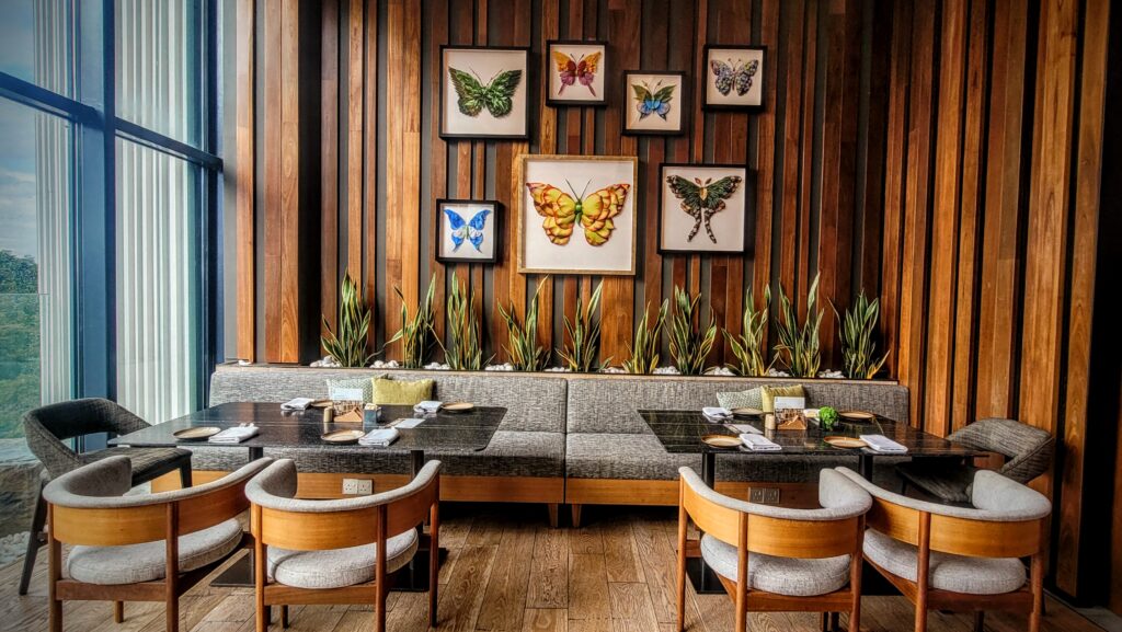 Delicate butterfly paper cuts and prints by Raku Inoue at ON22 restaurant Hyatt Centric Kota Kinabalu