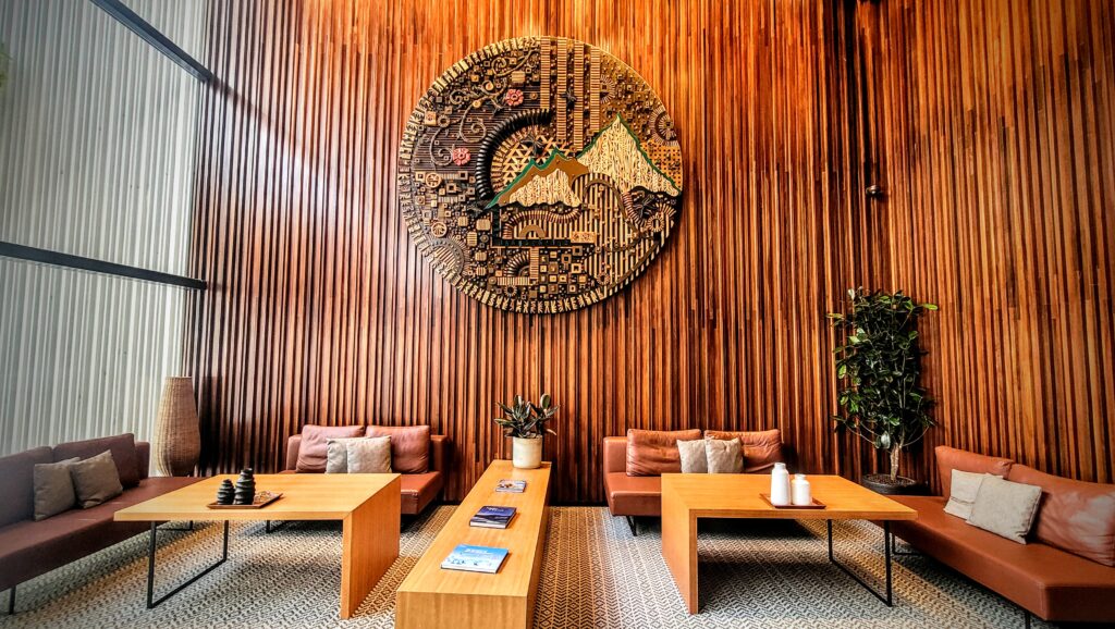 Hand-carved wood sculpture featuring Mount Kinabalu and Rafflesia flower at Hyatt Centric Kota Kinabalu