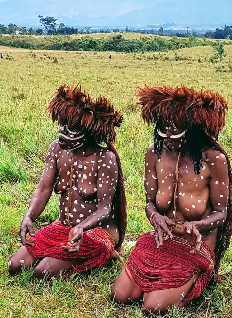 Dani women preparing for a traditional dance during the Baliem Valley Festival
