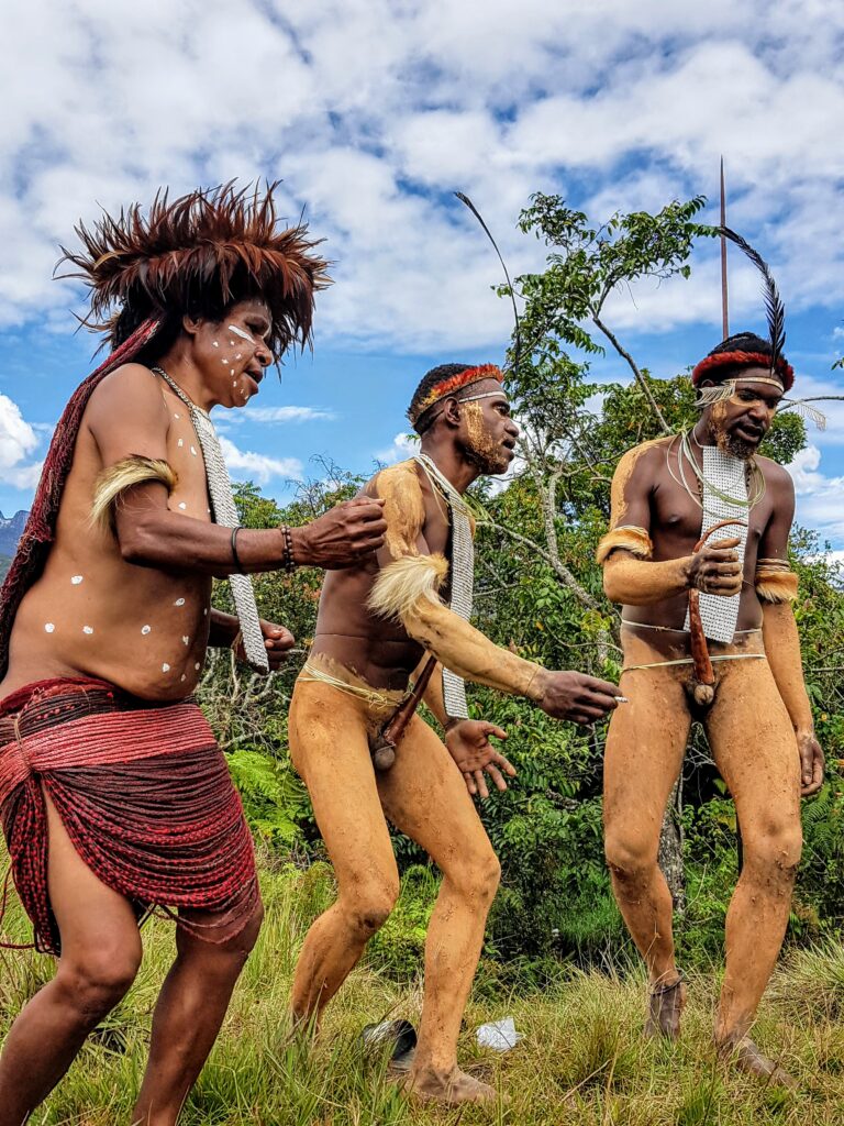 Dani Tribe performing a traditional dance at the Baliem Valley Festival in Wamena