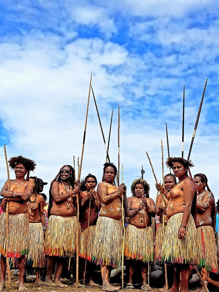 Dani women wearing traditional grass skirts at the Baliem Valley Festival.