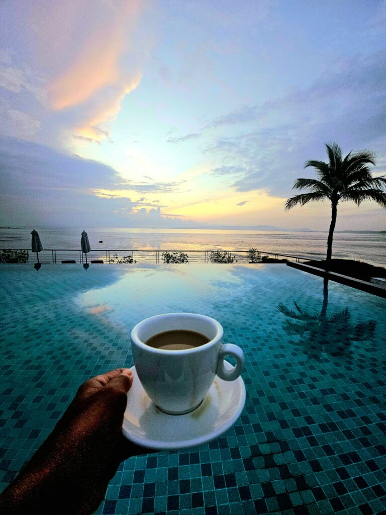 Morning coffee beside the infinity pool at Cove 55 boutique resort in Santubong, Sarawak