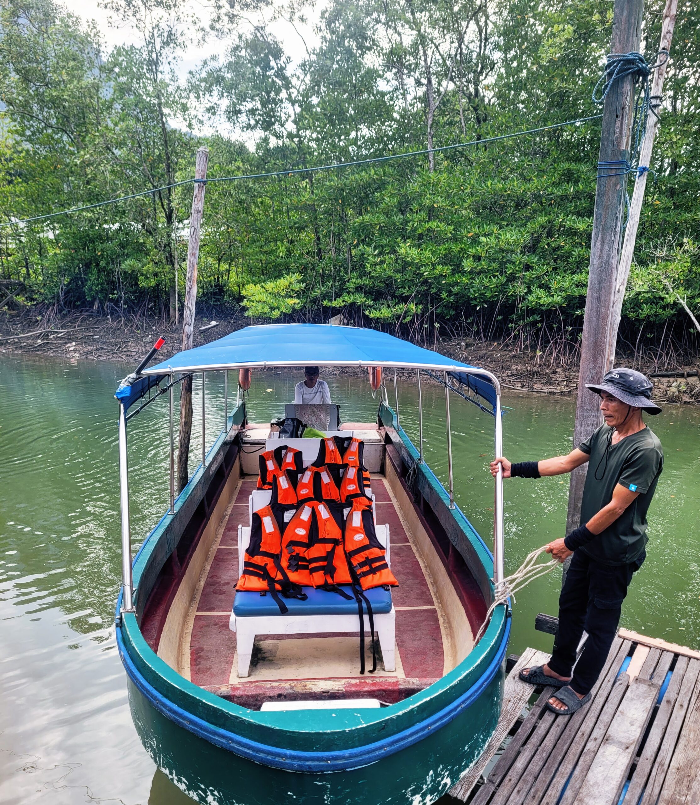 Boat waiting at the jetty before the Santubong Wetland River Cruise
