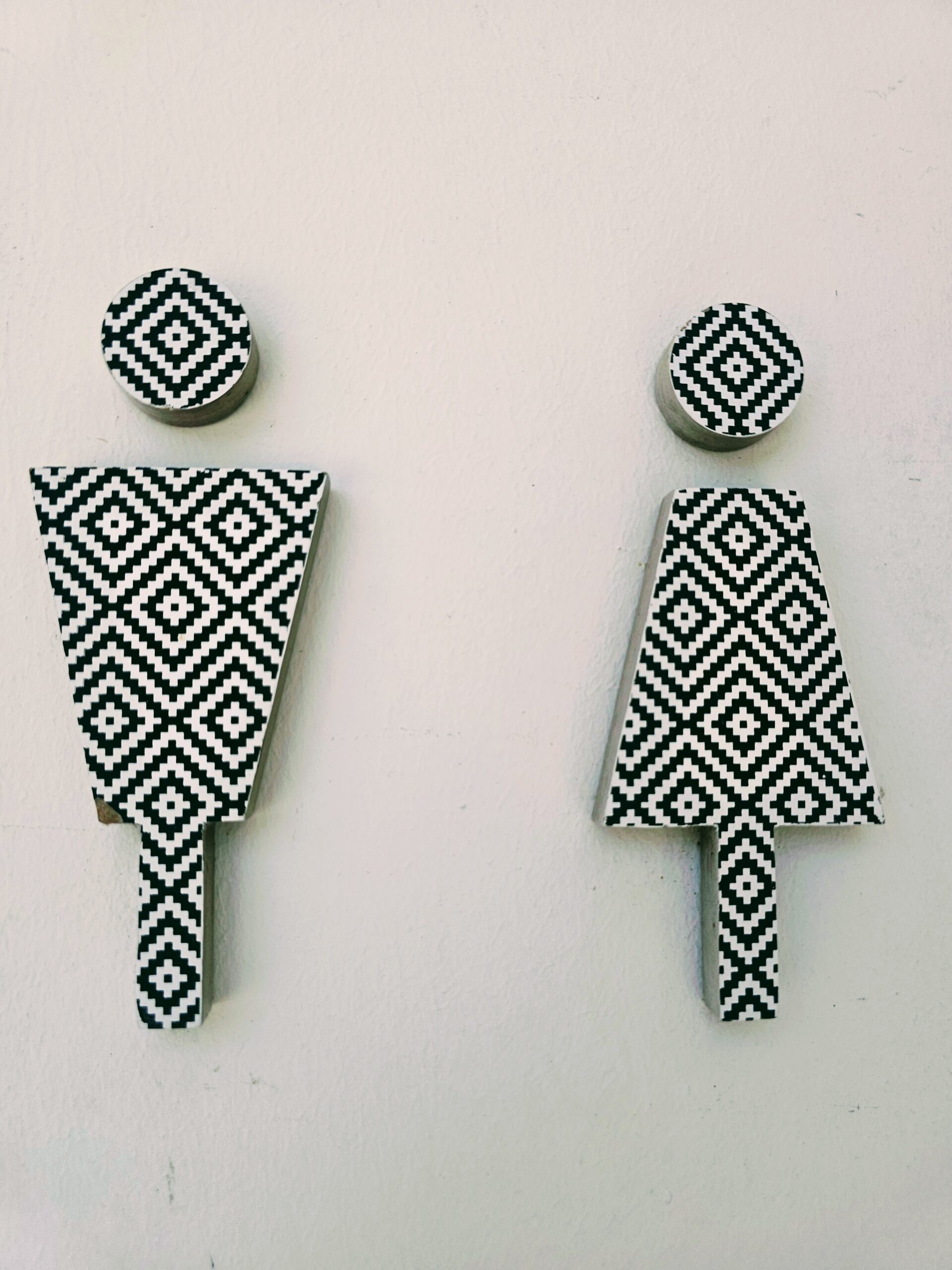 Toilet sign featuring traditional Sarawak-inspired artwork at Cove 55 boutique resort