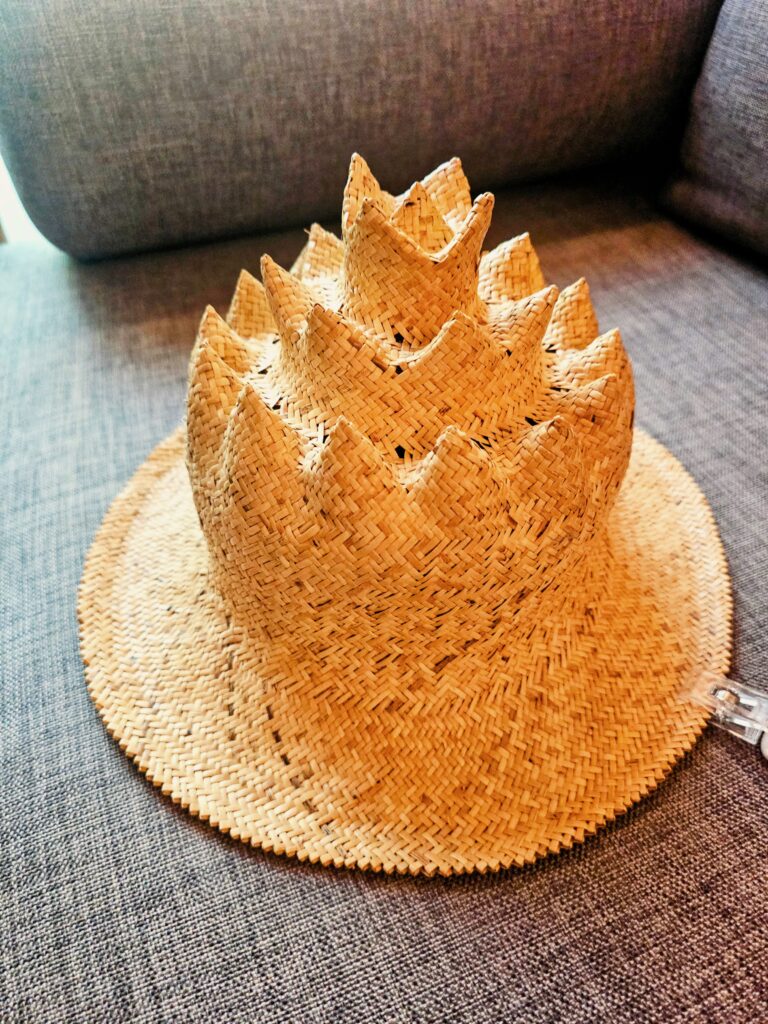 Traditional Iban warrior hat displayed in a guest room at Cove 55 boutique resort, Sarawak