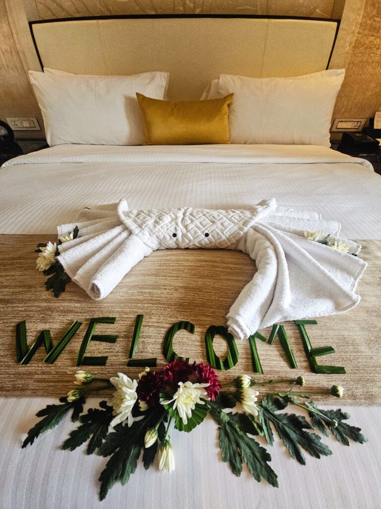 Crab-shaped towel decoration on the bed at The St. Regis Langkawi